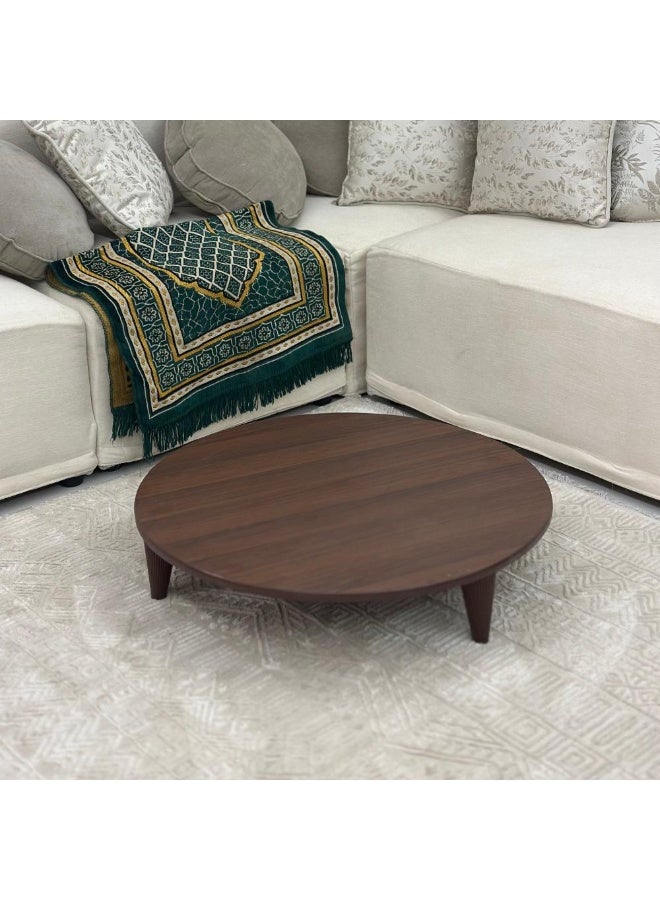 A round floor table with a stylish, modern design. - Image 1